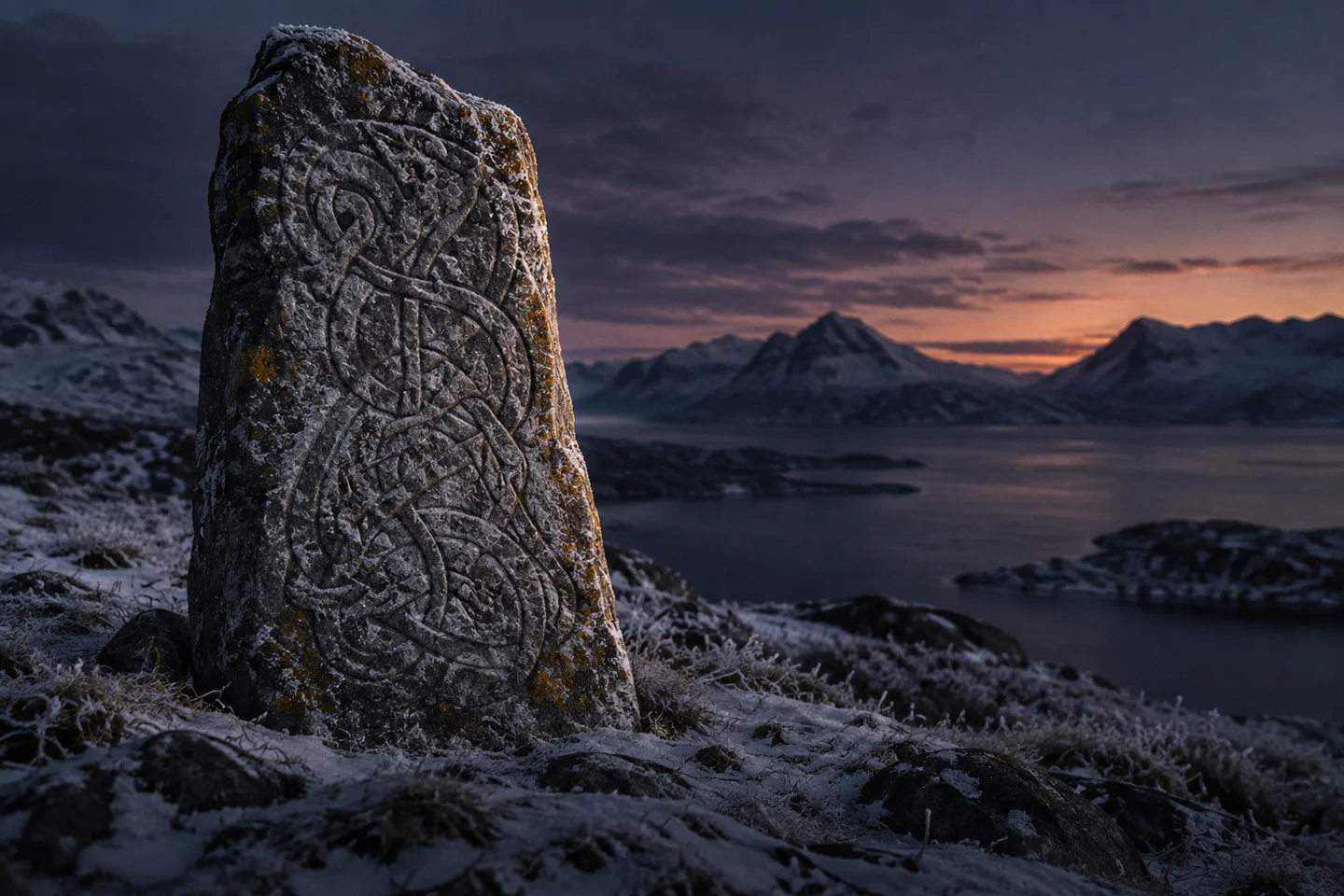 Weathered carvings on a Scandinavian standing stone.
